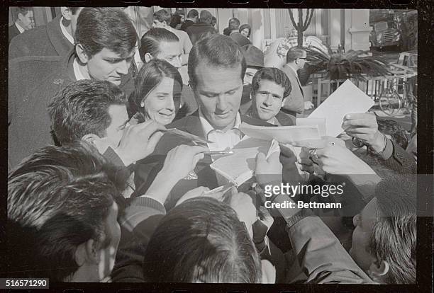 Autograph-hungry fans besiege American singer pat Boone here, where the Italian song Festival opened with 26 songs, sung both by Italian and foreign...