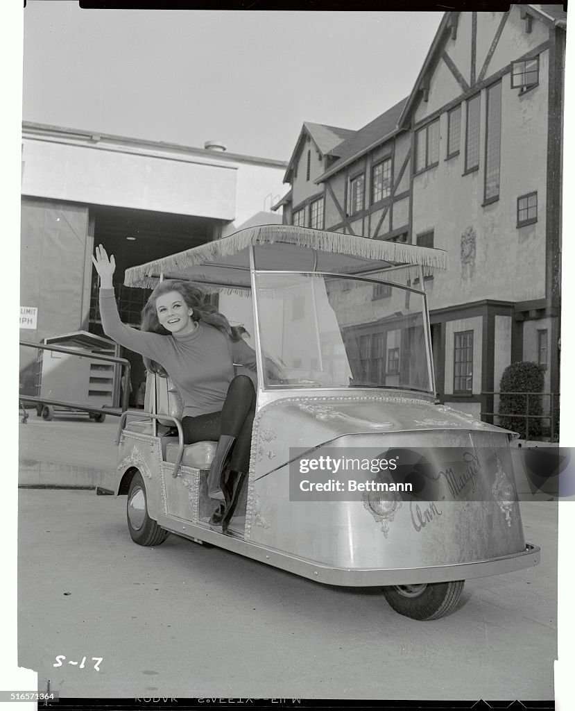 Ann-Margret Waving From Her Golf Cart