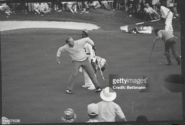 Augusta, Ga.: Jack Nicklaus tosses his golf ball down the 18th fairway after holing out to win the 1966 Masters in playoff against Tommy Jacobs and...