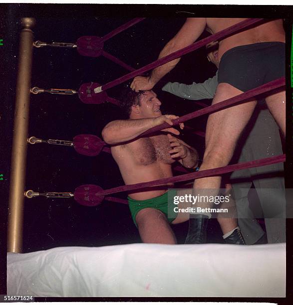 Referee Dan Bartfield tries to stop action as Michele Scicluma, of Malta, throttles strong-boy Bruno Sammartino, of Abruzzi, Italy, during their...