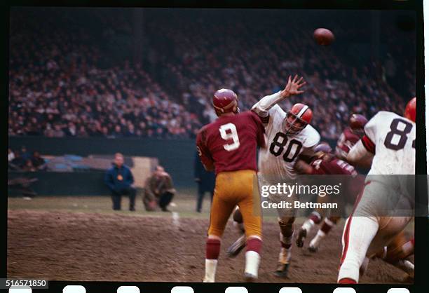 Cleveland Brown defensive end Bill Glass almost blocks a pass by Sonny Jurgensen of the Washington Redskins in action.