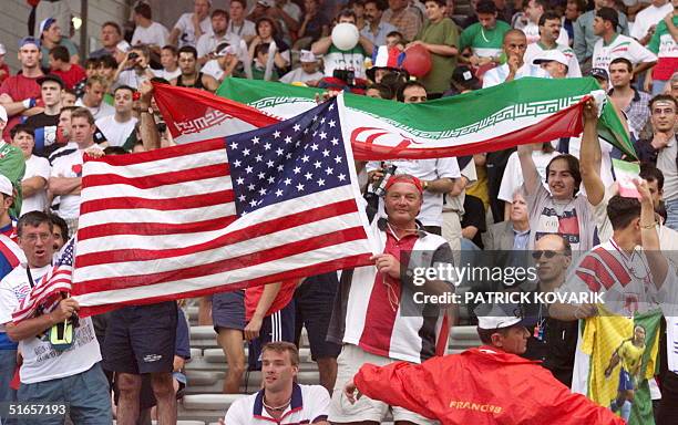 Iranian and US fans wave their national flag 21 June at the Gerland stadium in Lyon, central France, before the 1998 Soccer World Cup Group F first...