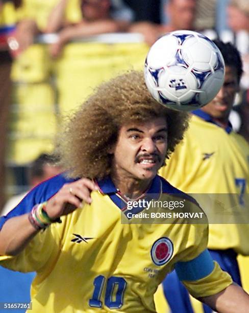 Colombian midfielder Carlos Valderrama heads the ball, 22 June at the Stade de la Mosson in Montpellier, during the World Cup second first-round...