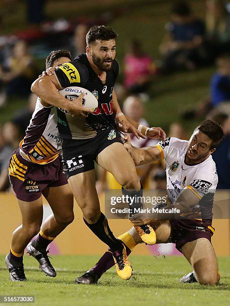 Josh Mansour of the Panthers is tackled by Ben Hunt of the Broncos during the round three NRL match between the Penrith Panthers and the Brisbane...