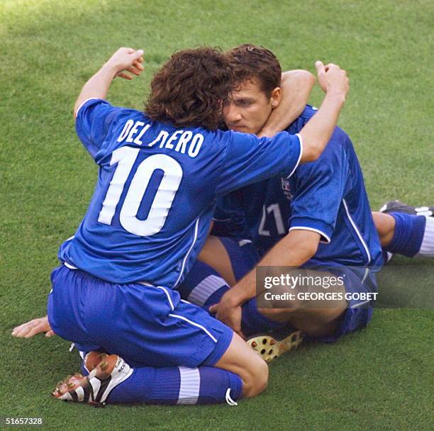 Italian forward Alessandro Del Piero congratulates team-mate and forward forward Christian Vieri after Vieri scored the first goal 27 June at the...