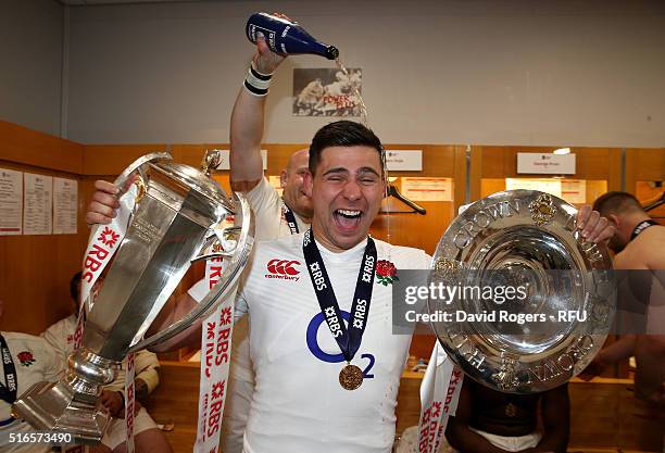 Grand Slam winning Ben Youngs of England celebrates with the trophy and triple crown shield following his team's 31-21 victory during the RBS Six...