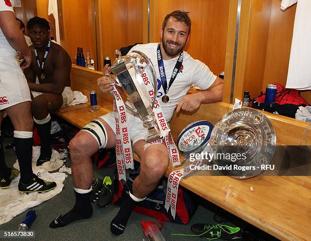 Grand Slam winner Chris Robshaw of England celebrates with the trophy following his team's 31-21 victory during the RBS Six Nations match between...