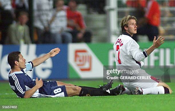 English midfielder David Beckham and Argentinan captain Diego Simeone react after foul play by Beckham during the 1998 Soccer World Cup second round...