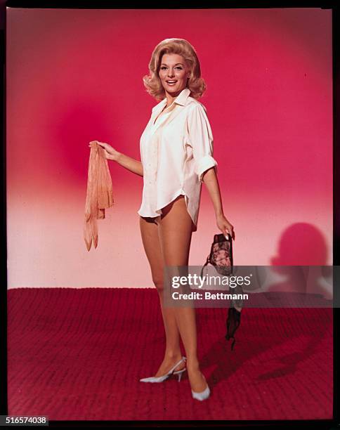 Actress Sharon Hugeny poses in Negligee before a mirror.