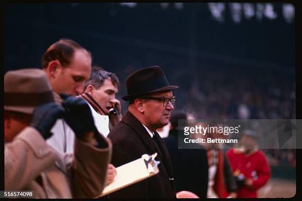 On the Cleveland Browns bench during action between the Browns and Washington Redskins, head coach Blanton Collier looks at action while quarterback...