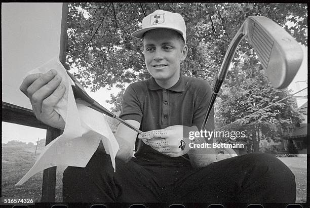 Bobby Cole of Springs Transvasal, South Africa, and 1966 British Amateur Champion, polishes his $6.00 driver, which cost him $1.25, 4 months ago, as...