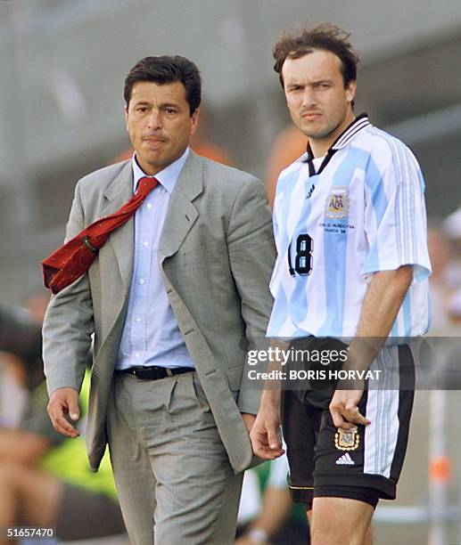Argentinan coach Daniel Alberto Passarella and forward Abel Balbo look dejected 04 July after their 1998 Soccer World Cup quarter-final match against...