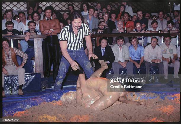 Two mudwrestlers in struggle at Chippendales in Los Angeles.