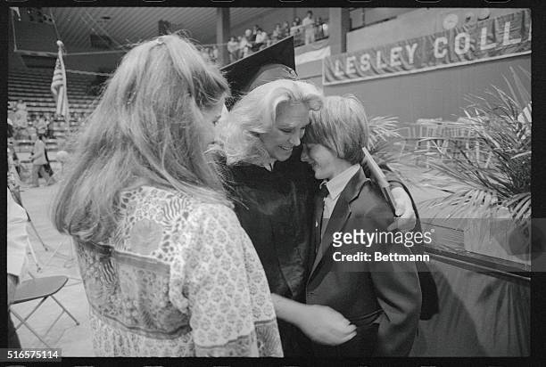 Joan Kennedy receives a hug from her son Patrick , her daughter Kara looks on, after Mrs. Kennedy received her master's degree in education from...