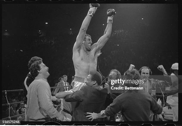 Unbeaten Gerry Cooney is lifted up by his admirers in the center of the ring following his devastating first round knockout of veteran Ron Lyle here.