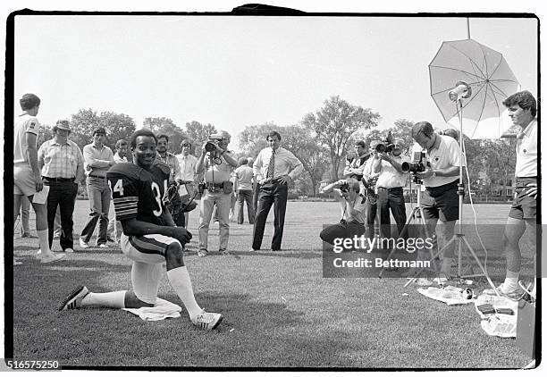 He's the center of attention during photo day at the Chicago Bears' training camp 7/24. Bears' star running back Walter Payton poses for...