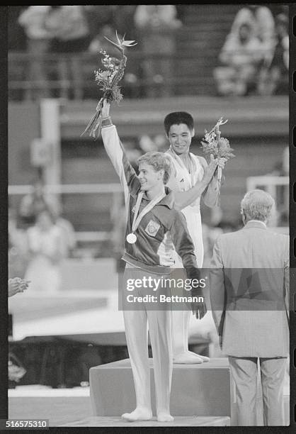 Los Angeles: Gold medal winner in men's individual gymnastics, Koji Gushiken of Japan looks at the silver medal winner, Peter Vidmar of the United...