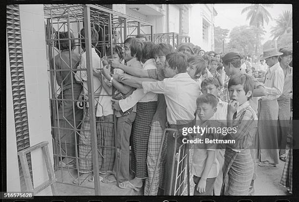 Rangoon: Street Scenes. Rangoon, Burma: Movie fans in entertainment-starved Burma wait in line whenever a foreign film is shown at government-owned...