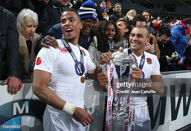 Anthony Watson and Jonathan Joseph of England celebrate winning the Grand Slam following the RBS Six Nations match between France and England at...