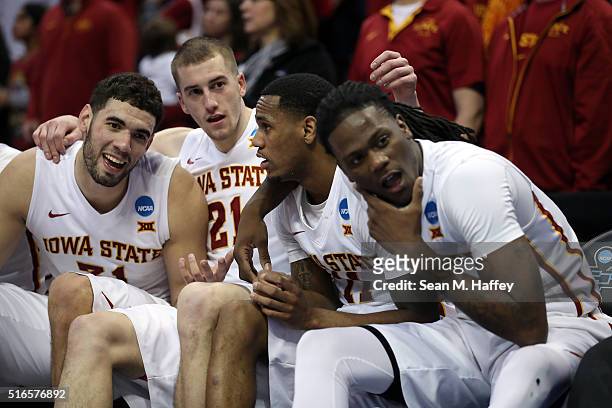 Georges Niang, Matt Thomas, Monte Morris and Jameel McKay of the Iowa State Cyclones celebrate from the bench late in the second half against the...