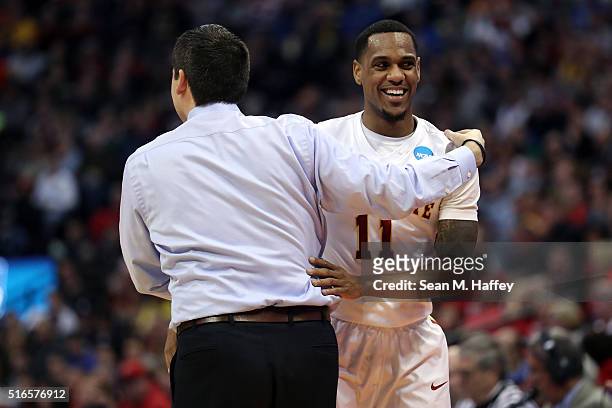 Monte Morris of the Iowa State Cyclones celebrates with head coach Steve Prohm in the second half against the Arkansas Little Rock Trojans during the...
