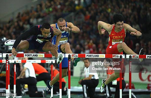 Dimitri Bascou of France and Wenjun Xie of China compete in the Men's 60 Metre Hurdles Heats during day three of the IAAF World Indoor Championships...