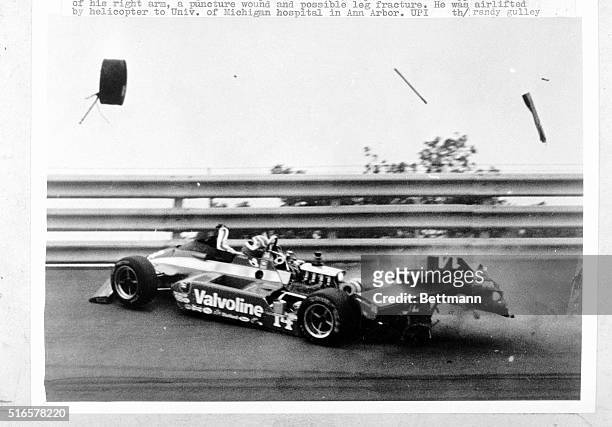 Race car driven by A.J. Foyt, of Houston, Texas, disintegrates after hitting the guard rail in turn two during the 80th lap of the Michigan 500 Indy...