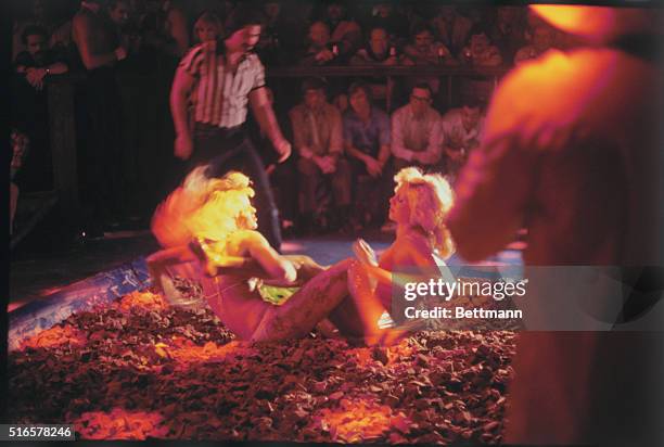 Two mudwrestlers in struggle at Chippendales in Los Angeles.