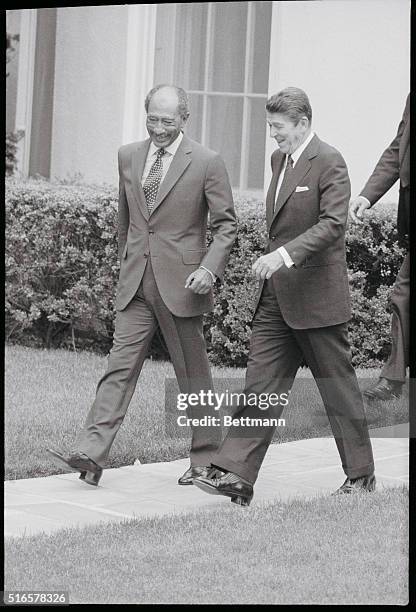 Washington: Egyptian President Anwar Sadat and President Reagan leave the White House in step 8/5, after their meeting. President Reagan told...