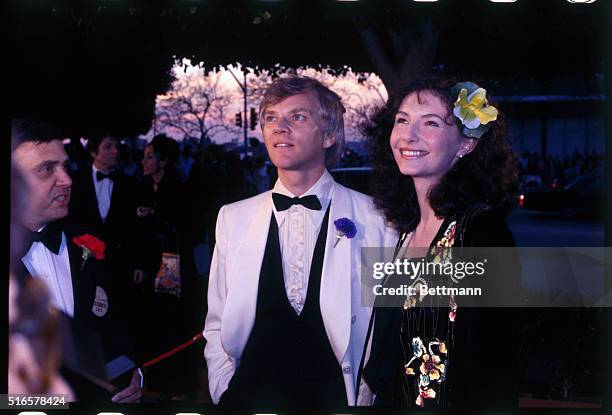 Actress Mary Steenburgen arrives at the Academy Awards with actor Malcolm McDowell.