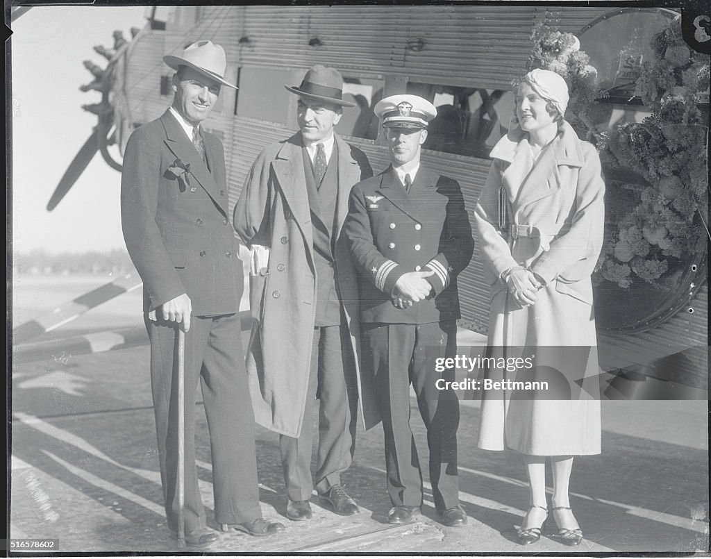 People Standing in Front of Plane