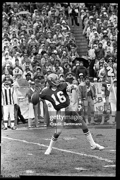San Francisco 49er quarterback Joe Montana is shown in the beginning of the process of passing the football in this game against the Cleveland...