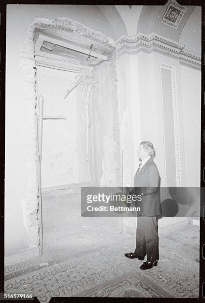Sen. Mack Mattingly, R-GA, looks at a 13-foot hole 11/8 which was torn in an alcove by a bomb which exploded 30 feet fro the Senate chamber in the...