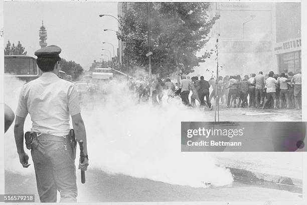 Santiago, Chile: Police use tear gas and a water cannon to disperse a demonstration by some 1650 priests, nuns and pacifists protesting against the...