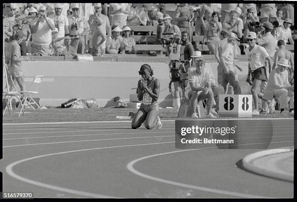 S Valerie Brisco Hooks drops to her knees and says thanks, moments after winning the 400m, and taking home the Gold Medal for an American athlete.