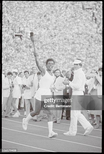 Los Angeles: Gina Hemphill, grandaughter of Jesse Owens carries Olympic torch into LA Coliseum.