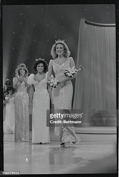 Sharlene Wells, Miss America 1985, begins her walk here down the runway as Suzette Charles, Miss America 1984 looks on, and Miss Mississippi, Kathy...