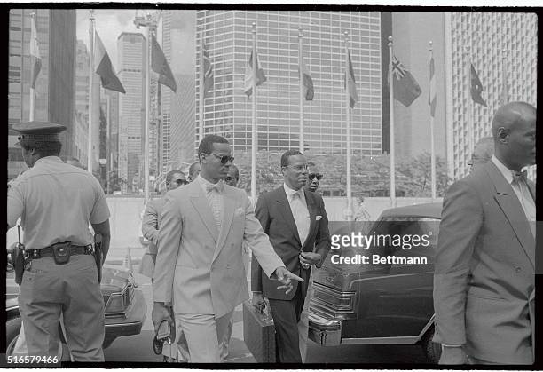 With his personal bodyguard leading the way, Louis Farrakhan , leader of the Nation of Islam, enters the United Nations 8/20 where he was to meet...