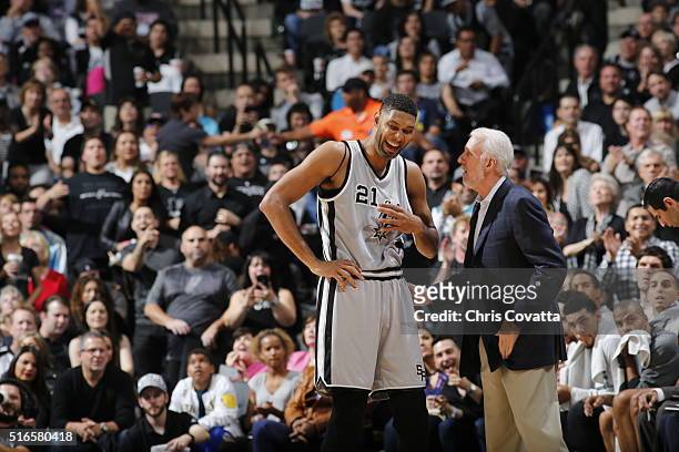 Tim Duncan of the San Antonio Spurs talks with Head Coach Gregg Popovich of the San Antonio Spurs during the game against the Golden State Warriors...