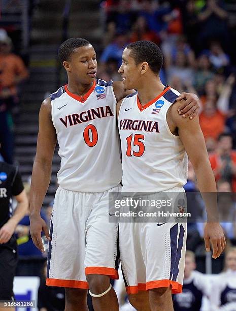 Devon Hall and Malcolm Brogdon of the Virginia Cavaliers celebrate their 77-69 win over the Butler Bulldogs during the second round of the 2016 NCAA...