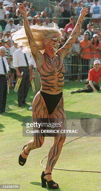 Streaker painted as a tiger runs across the 18th green after Justin Leonard of the US won the 126th British Open Golf Championship, 20 July, at Royal...