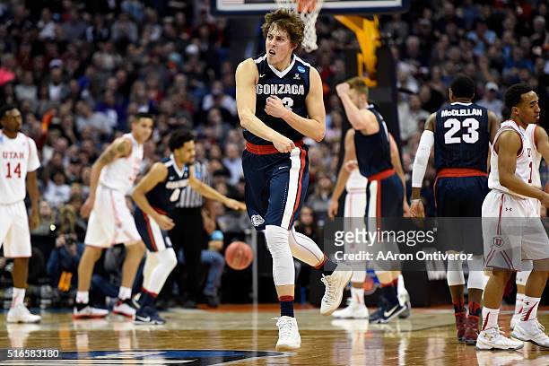 Kyle Wiltjer of the Gonzaga Bulldogs celebrates after hitting a three pointer against the Utah Utes during the first half of their second round NCAA...