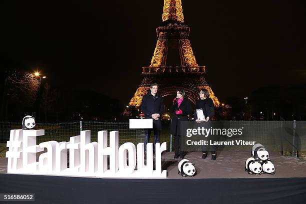 Of WWF France Pascal Canfin, Mayor of Paris Anne Hidalgo and Deputy mayor in charge of the environment Celia Blauel attend Lights Tour Eiffel turn...