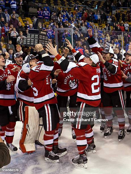 Kevin Roy and teammate Tanner Pond of the Northeastern Huskies celebrates as the Huskies win the Hockey East Championship against the Massachusetts...
