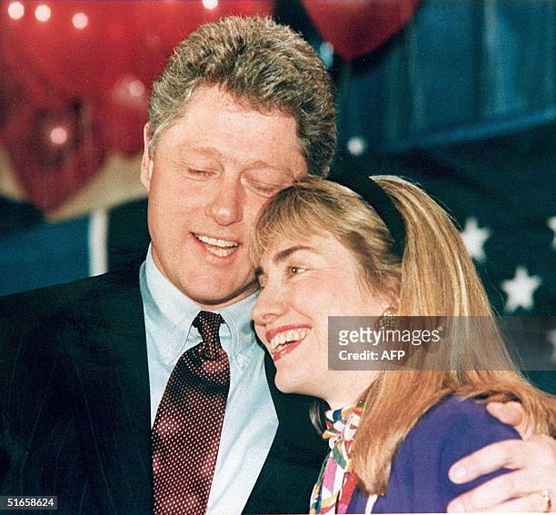 Photo shows then Governor of Arkansas Bill Clinton and his wife Hillary embracing. Clinton has been accused of having an affair with a former White...