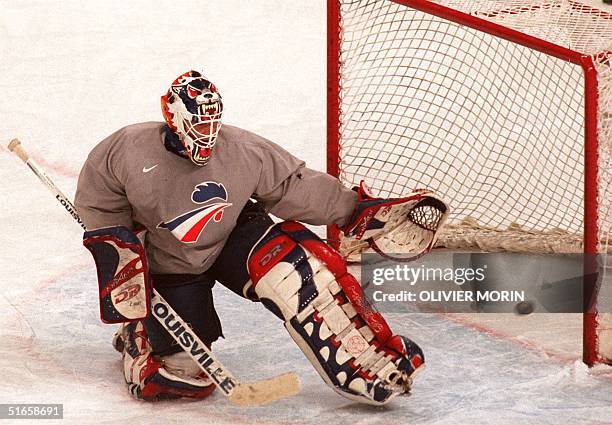 French goalkeeper Cristobal Huet watches the puck enter his goal during the French men's Olympic hockey team training at the Big Hat in Nagano 06...