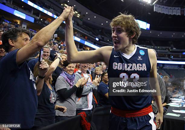 Kyle Wiltjer of the Gonzaga Bulldogs celebrates with fans after defeating the Utah Utes with a score of 82 to 59 during the second round of the 2016...