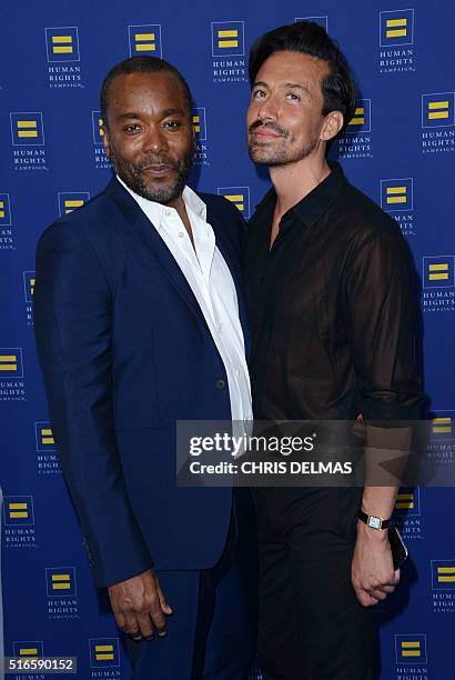 Lee Daniels and Jahil Fisher arrive for the Human Rights Campaign 2016 Los Angeles Gala Dinner in Los Angeles, California, March 19, 2016. / AFP /...