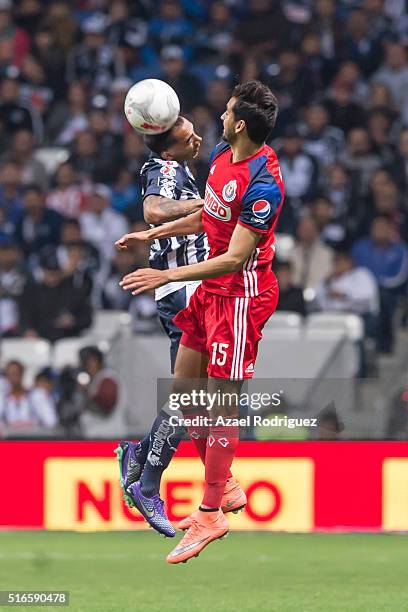 Edgar Castillo of Monterrey heads the ball with Raul Lopez of Chivas during the 11th round match between Monterrey and Chivas as part of the Clausura...