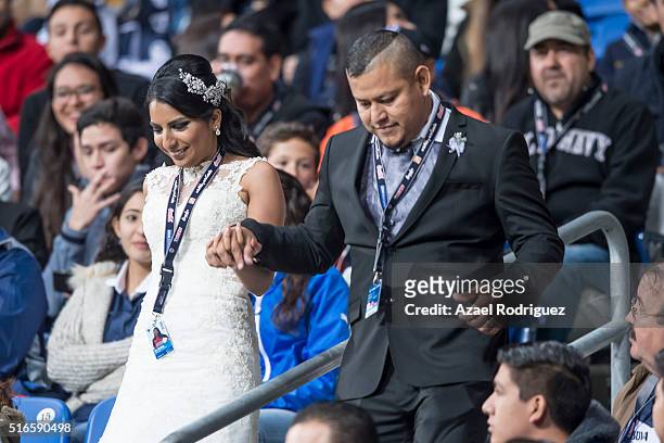 Newly wed fans of Monterrey arrive at the BBVA Stadium to cheer their team during the 11th round match between Monterrey and Chivas as part of the...